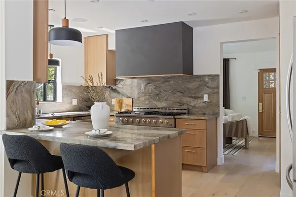 a kitchen with a dining table and chairs