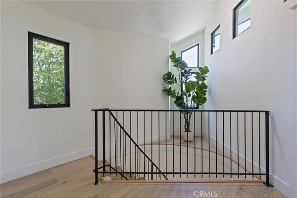 a view of entryway with wooden floor