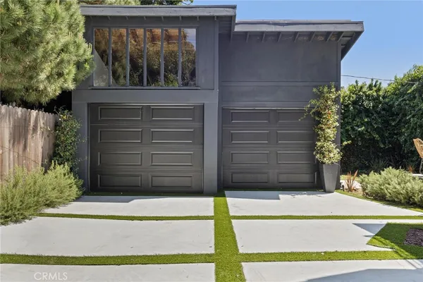 a view of house with garage