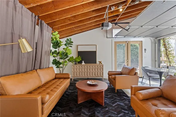 a outdoor living space with furniture and a potted plant