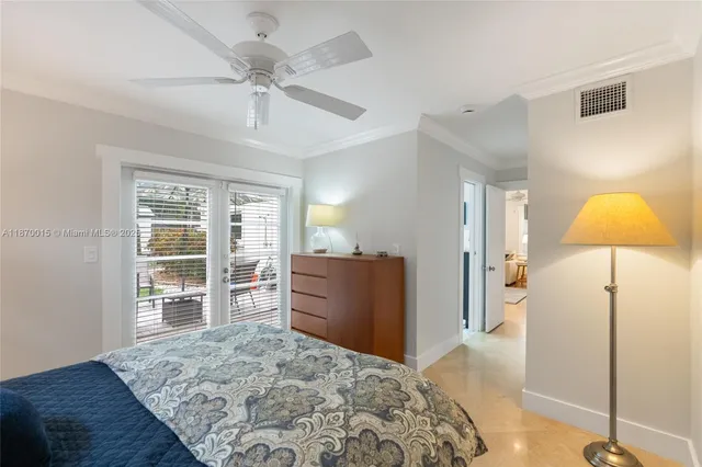 a bedroom with a bed and a dresser in it