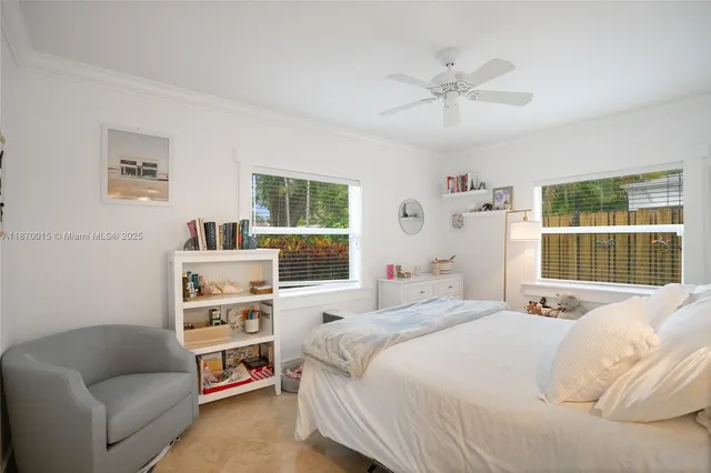 a bedroom with a bed furniture and window