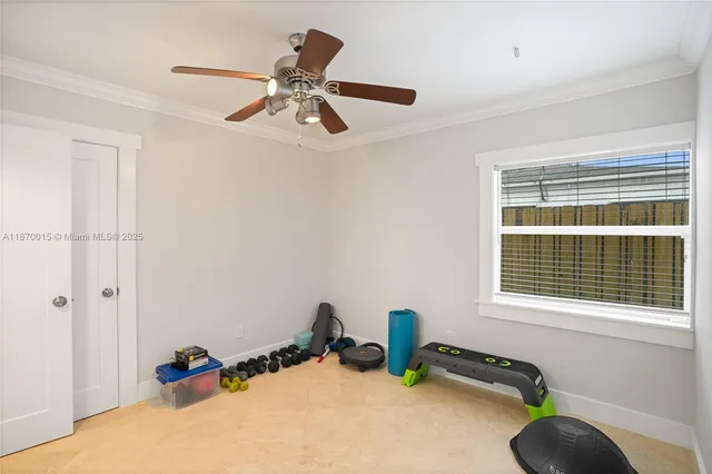 a room with gym equipment and a window