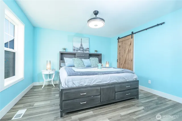 a bedroom with a bed and a table