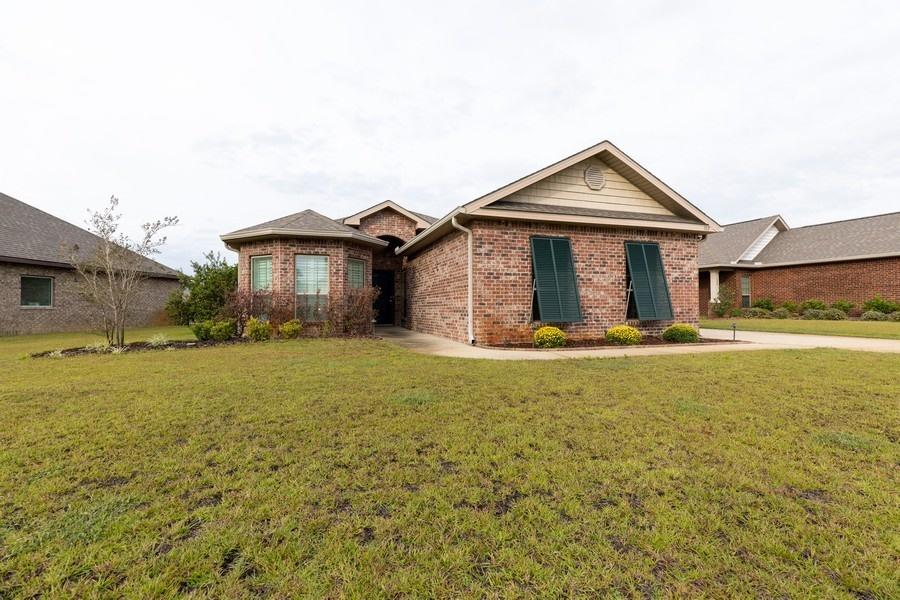 a front view of a house with yard