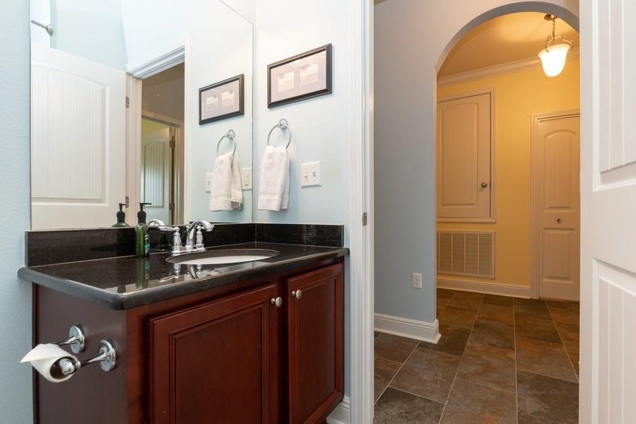 387 Pin Oak Loop Santa Rosa Beach, FL 32459 - Photo 11 of 36 a bathroom with a granite countertop sink a two mirror a shower and a mirror