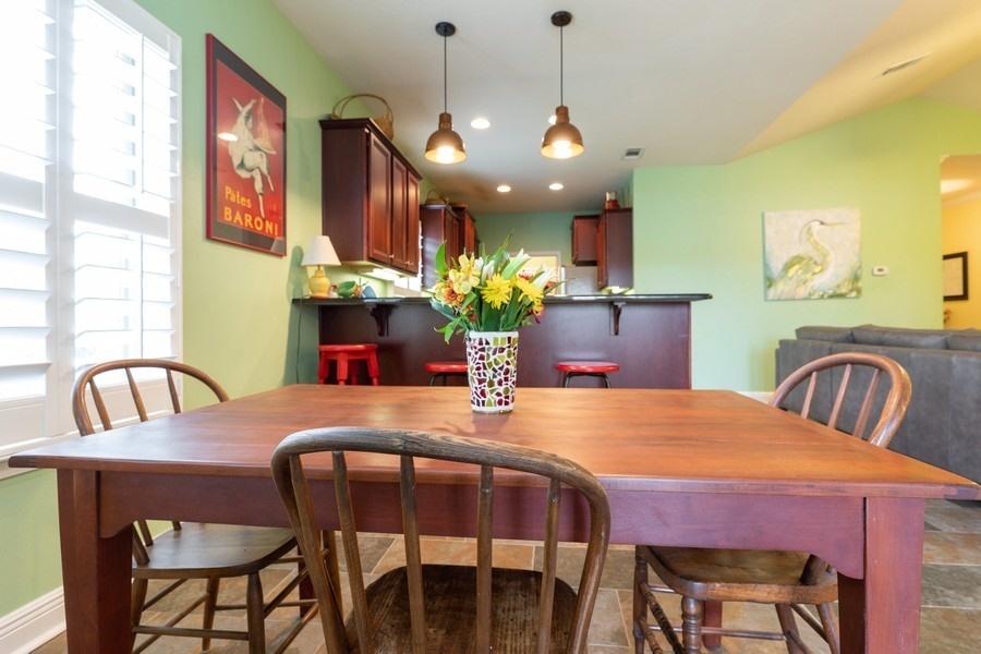 387 Pin Oak Loop Santa Rosa Beach, FL 32459 - Photo 17 of 36 a view of a dining room with furniture