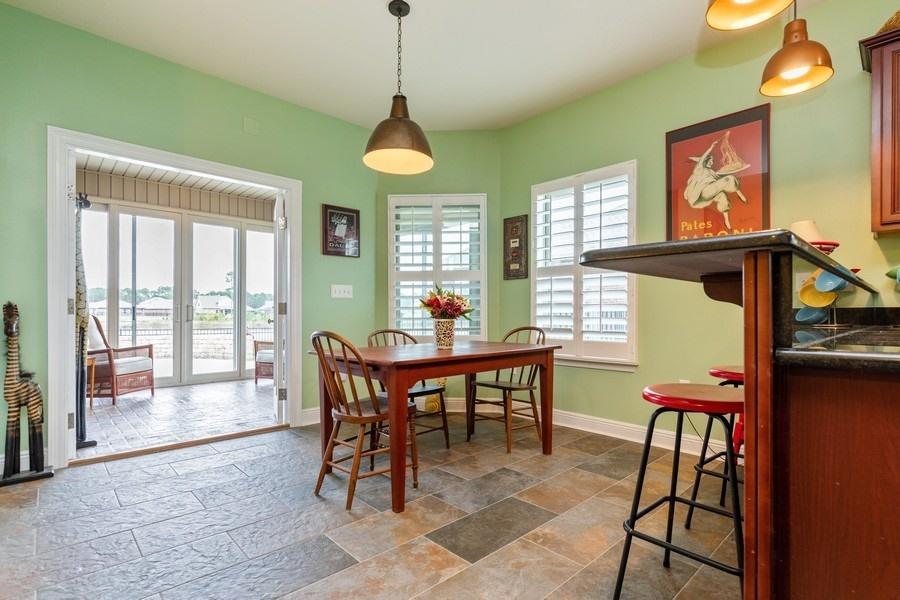 387 Pin Oak Loop Santa Rosa Beach, FL 32459 - Photo 18 of 36 a dining room with furniture and window