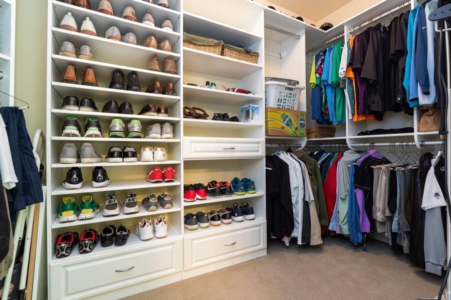 387 Pin Oak Loop Santa Rosa Beach, FL 32459 - Photo 27 of 36 a view of walk in closet with clothes and shoes