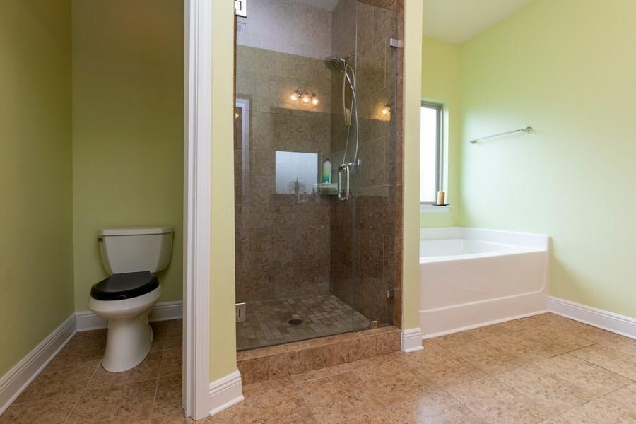 387 Pin Oak Loop Santa Rosa Beach, FL 32459 - Photo 28 of 36 a bathroom with a toilet and a shower