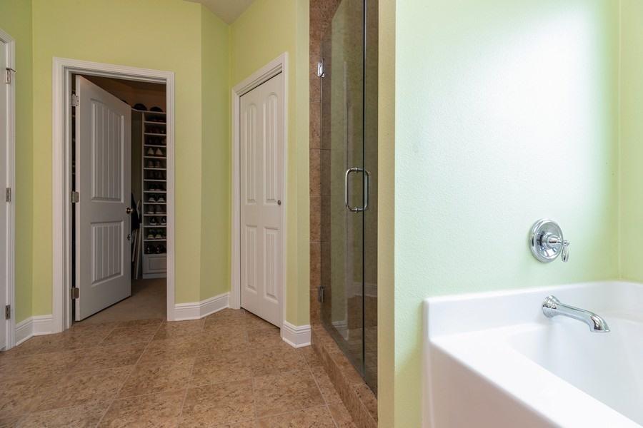 387 Pin Oak Loop Santa Rosa Beach, FL 32459 - Photo 29 of 36 a bathroom with a tub and sink