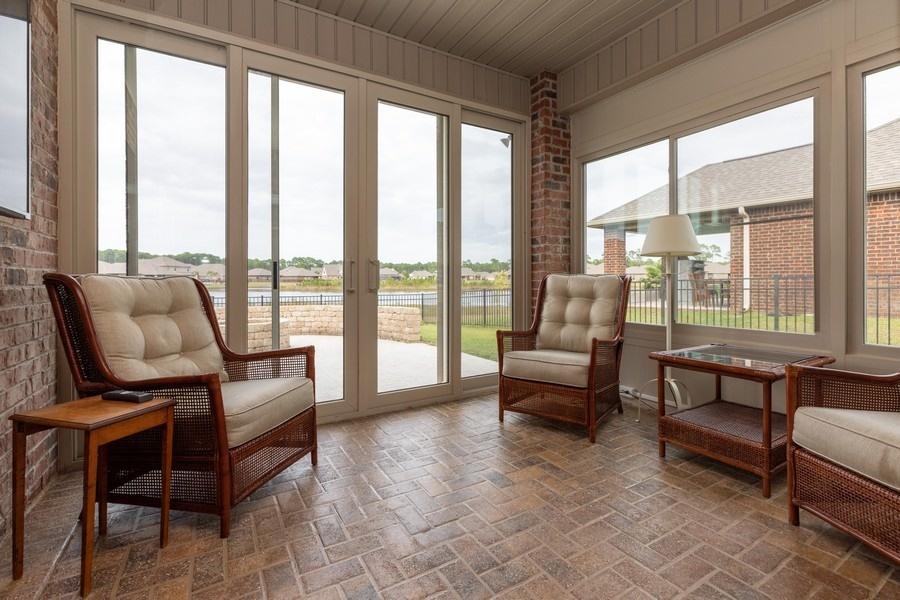 387 Pin Oak Loop Santa Rosa Beach, FL 32459 - Photo 31 of 36 a living room with furniture and a floor to ceiling window