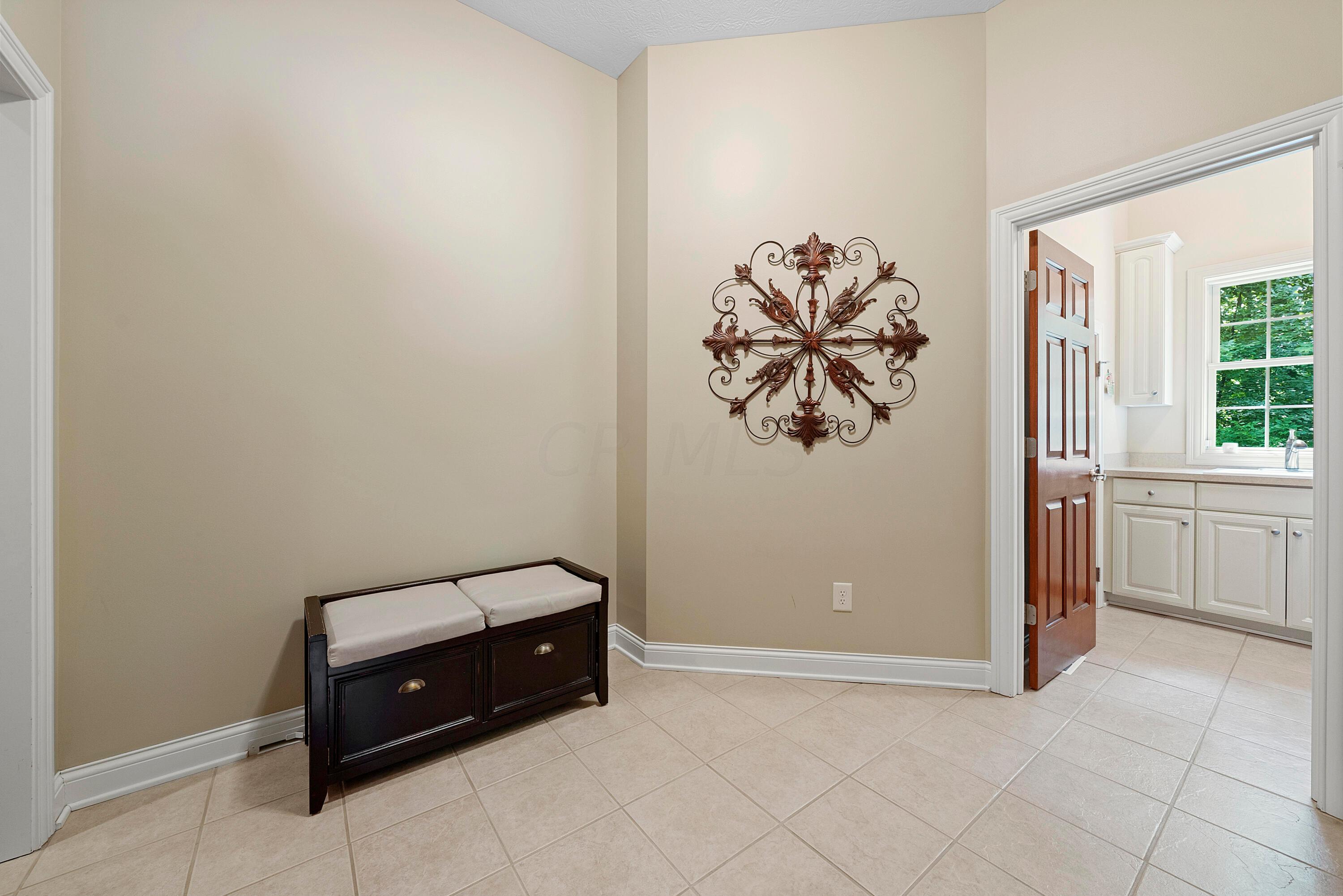 5761 Hughes Road Galena, OH 43021 - Photo 22 of 43 Great second entry area with Mud Room space, a door to the attached Garage, double door coat closet, broom closet