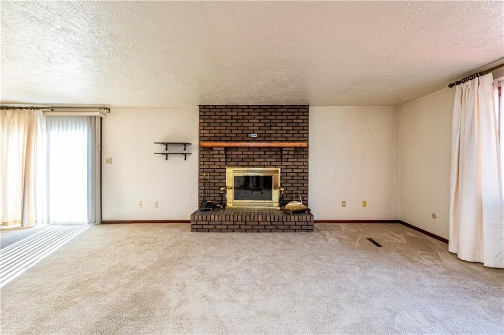 2002 Michael Avenue Irwin, PA 15642 - Photo 12 of 49 an empty room with fireplace