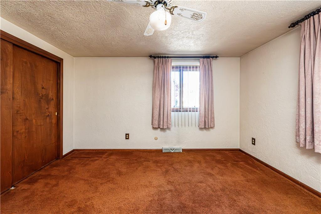 2002 Michael Avenue Irwin, PA 15642 - Photo 22 of 49 an empty room with windows and chandelier fan