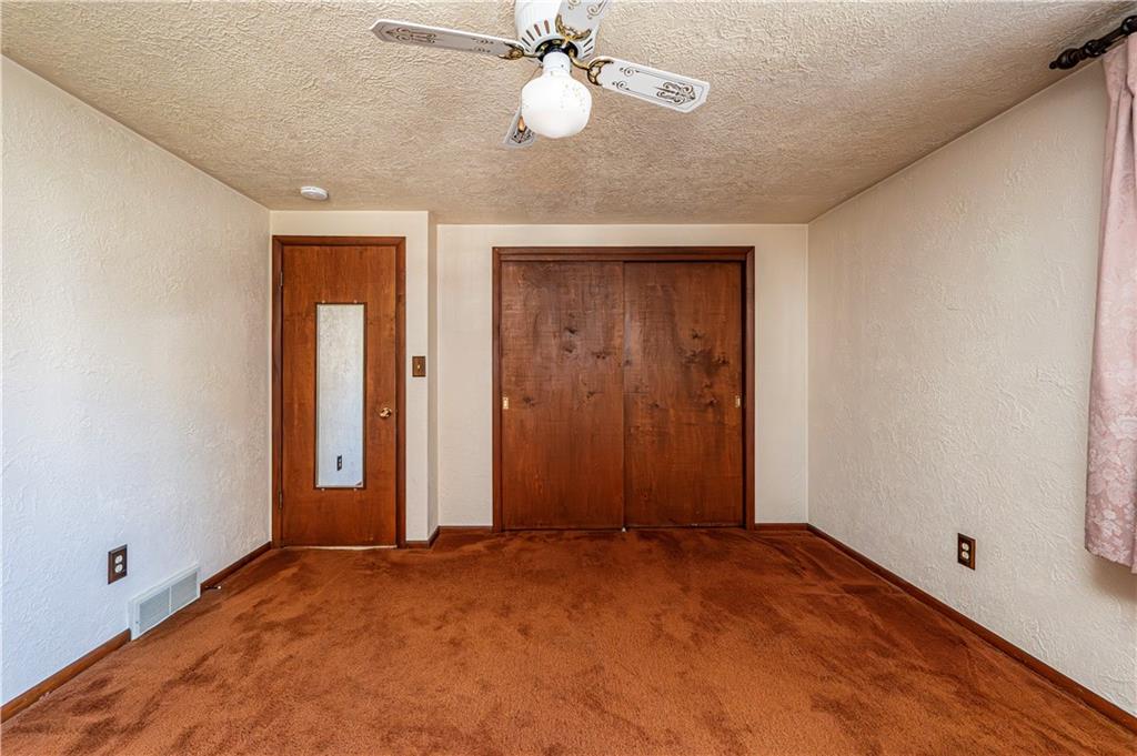 2002 Michael Avenue Irwin, PA 15642 - Photo 24 of 49 an empty room with closet and a chandelier fan