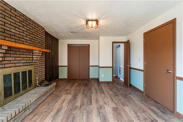 a view of a room with wooden floor and stairs