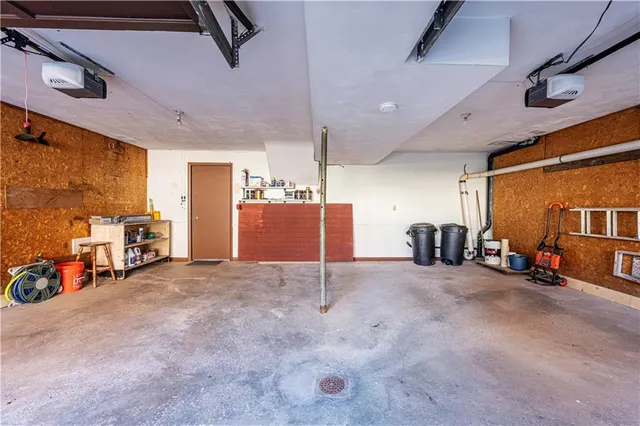 an aerial view of a house with a swimming pool yard and lake view