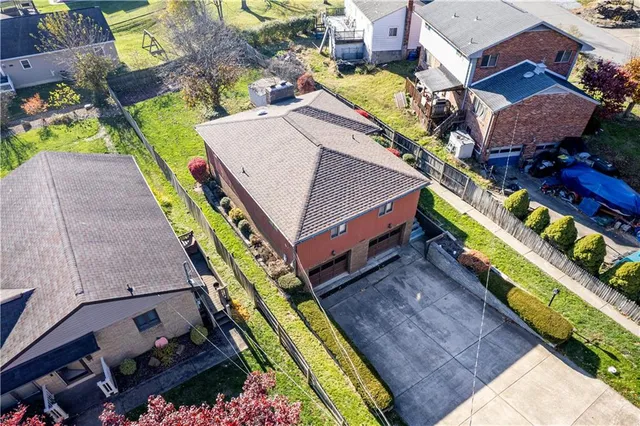 an aerial view of houses with yard