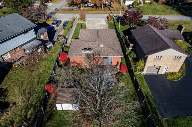 an aerial view of houses with outdoor space