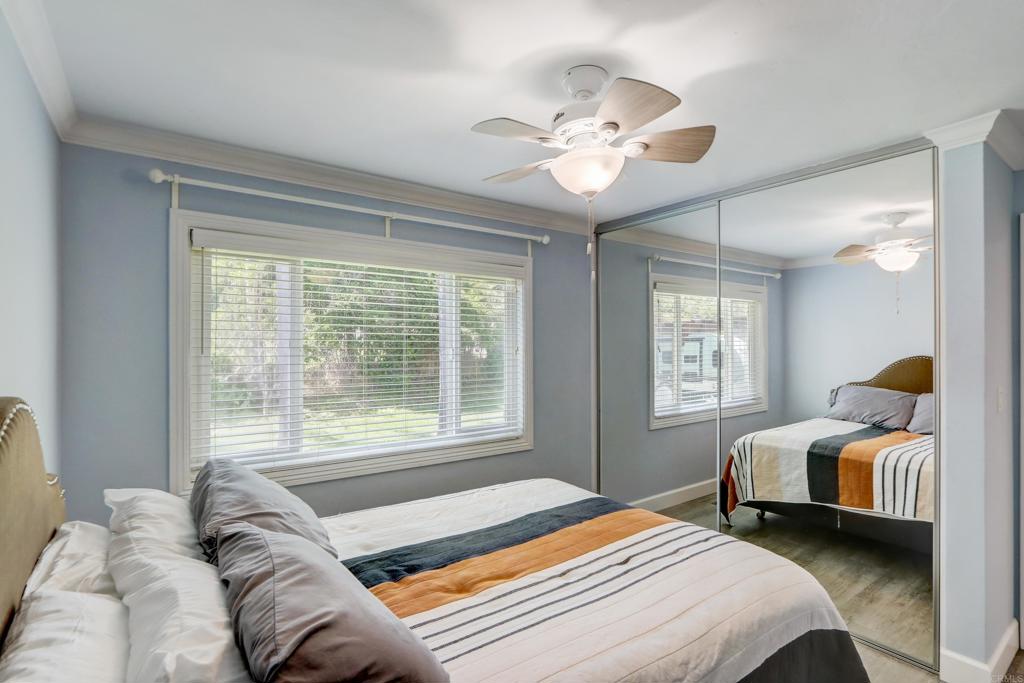 136 Hannalei Drive Vista, CA 92083 - Photo 12 of 32 a bedroom with a bed and window