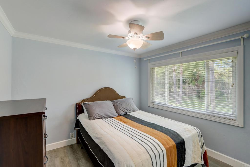 136 Hannalei Drive Vista, CA 92083 - Photo 13 of 32 a bedroom with a bed and a window