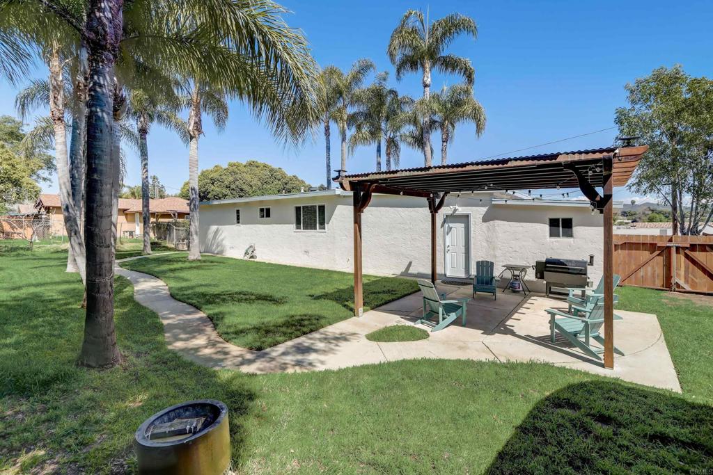 136 Hannalei Drive Vista, CA 92083 - Photo 23 of 32 a view of a chair and table in backyard
