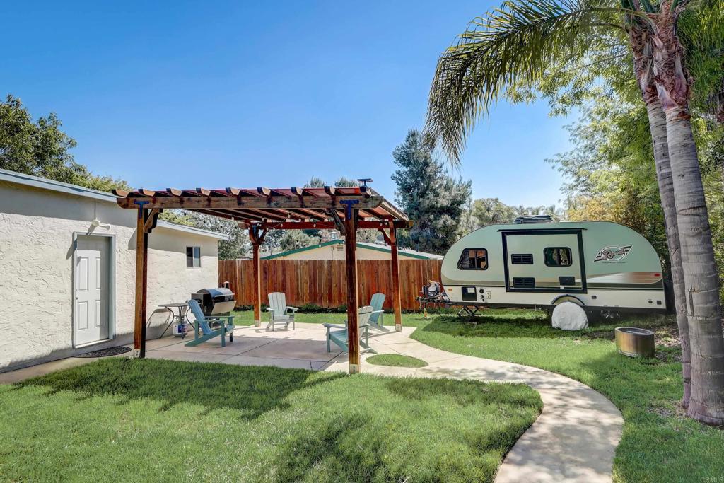 136 Hannalei Drive Vista, CA 92083 - Photo 24 of 32 a house view with a sitting space and garden