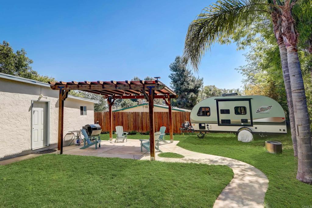 136 Hannalei Drive Vista, CA 92083 - Photo 25 of 32 a house view with a sitting space and garden