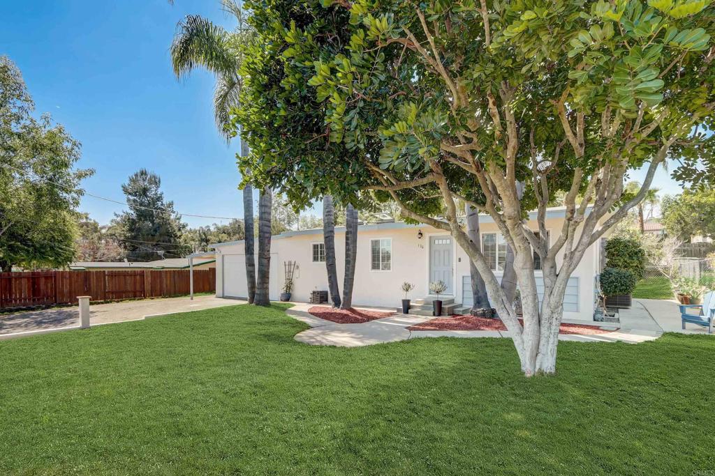 136 Hannalei Drive Vista, CA 92083 - Photo 3 of 32 a view of a backyard with a tree