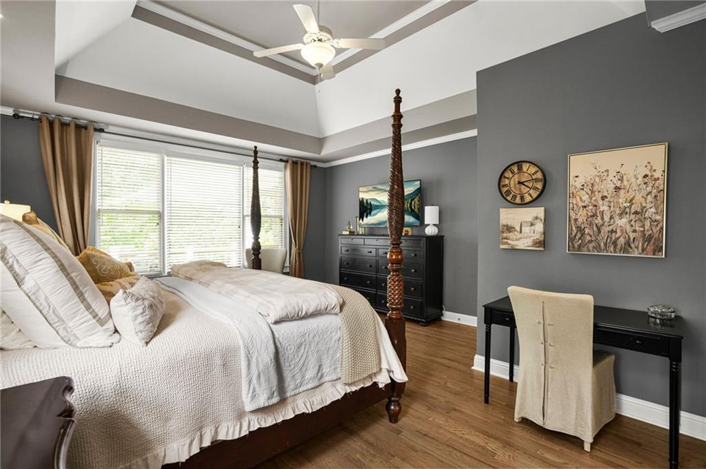 509 Crested Hawk Ridge Canton, GA 30114 - Photo 30 of 89 a spacious bedroom with a bed and a desk