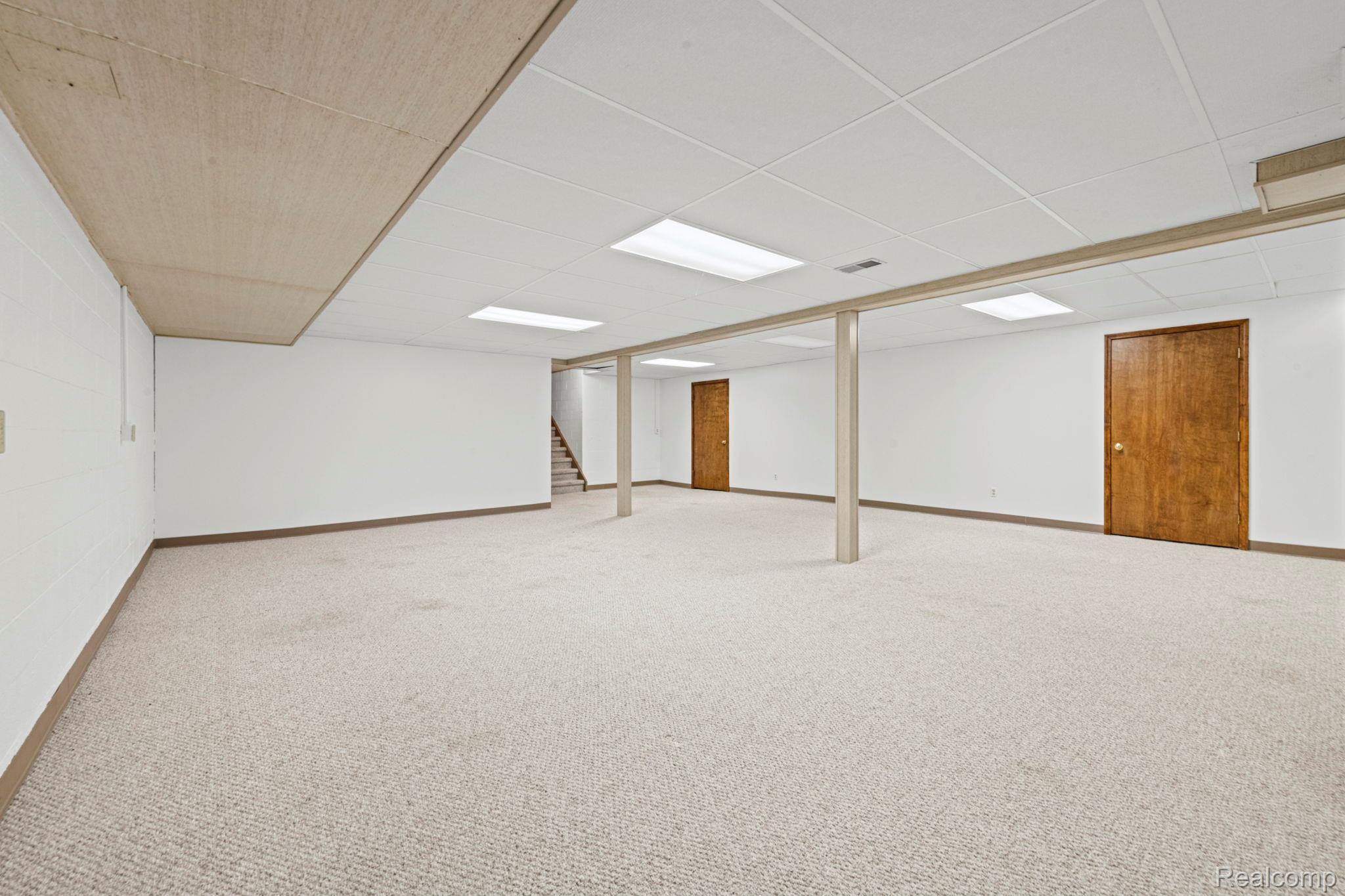 21580 Georgetown Road Trenton, MI 48183 - Photo 25 of 36 Expansive carpeted area featuring a drop ceiling with recessed lighting