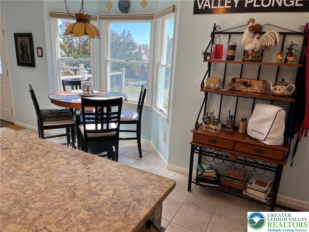 205 Spyglass Hill Road Bath, PA 18014 - Photo 11 of 51 a view of a dining room with furniture window and outside view