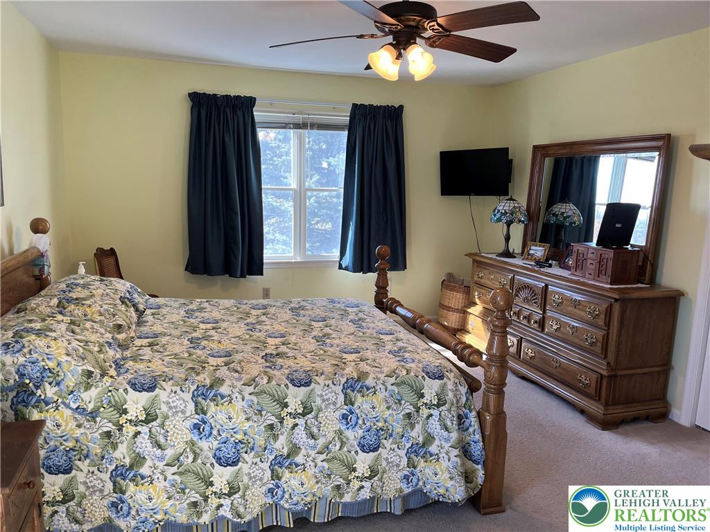 205 Spyglass Hill Road Bath, PA 18014 - Photo 19 of 51 a bedroom with a bed and flat screen tv