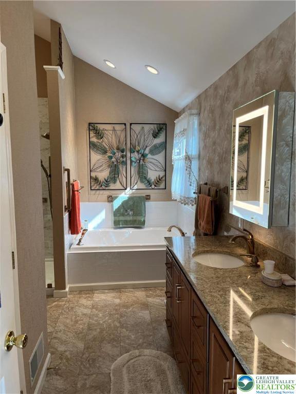 205 Spyglass Hill Road Bath, PA 18014 - Photo 22 of 51 a spacious bathroom with a granite countertop sink and a large mirror