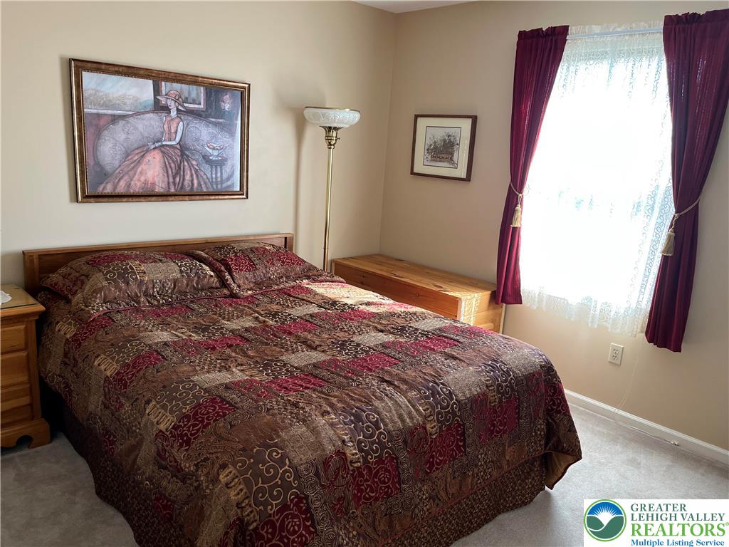 205 Spyglass Hill Road Bath, PA 18014 - Photo 26 of 51 a bedroom with a bed and a painting on the wall