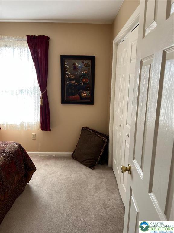 205 Spyglass Hill Road Bath, PA 18014 - Photo 27 of 51 a bedroom with a bed and a mirror