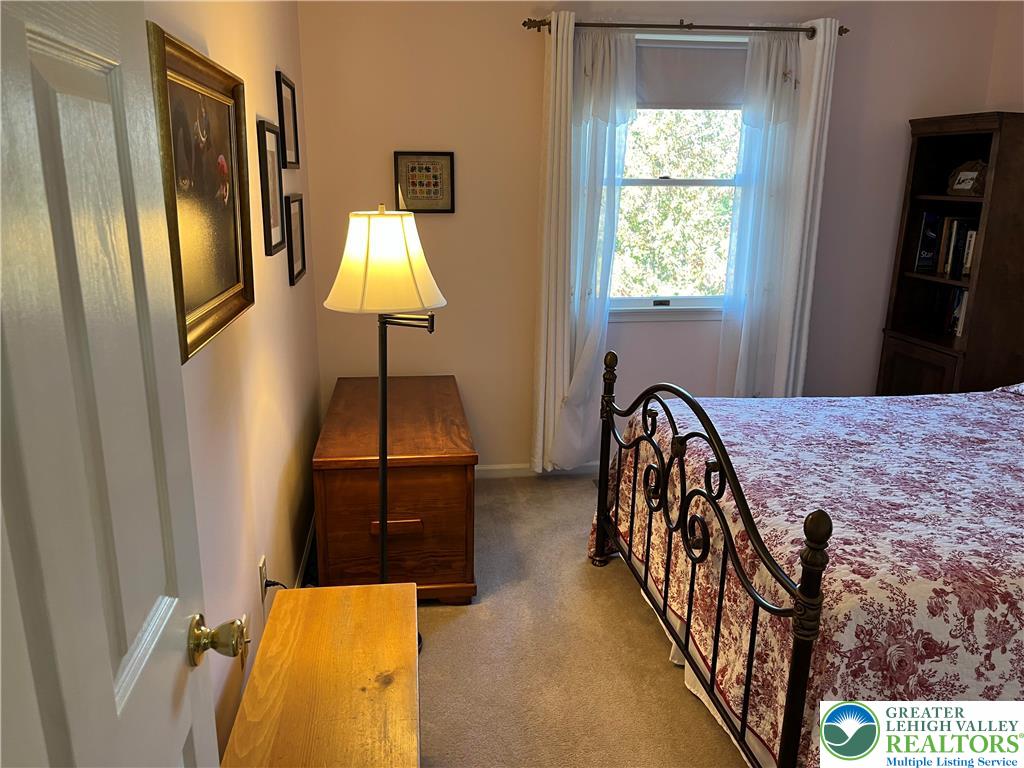 205 Spyglass Hill Road Bath, PA 18014 - Photo 31 of 51 a bedroom with bed and wooden floor