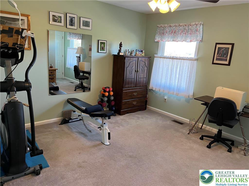 205 Spyglass Hill Road Bath, PA 18014 - Photo 33 of 51 a room with gym equipment and a mirror