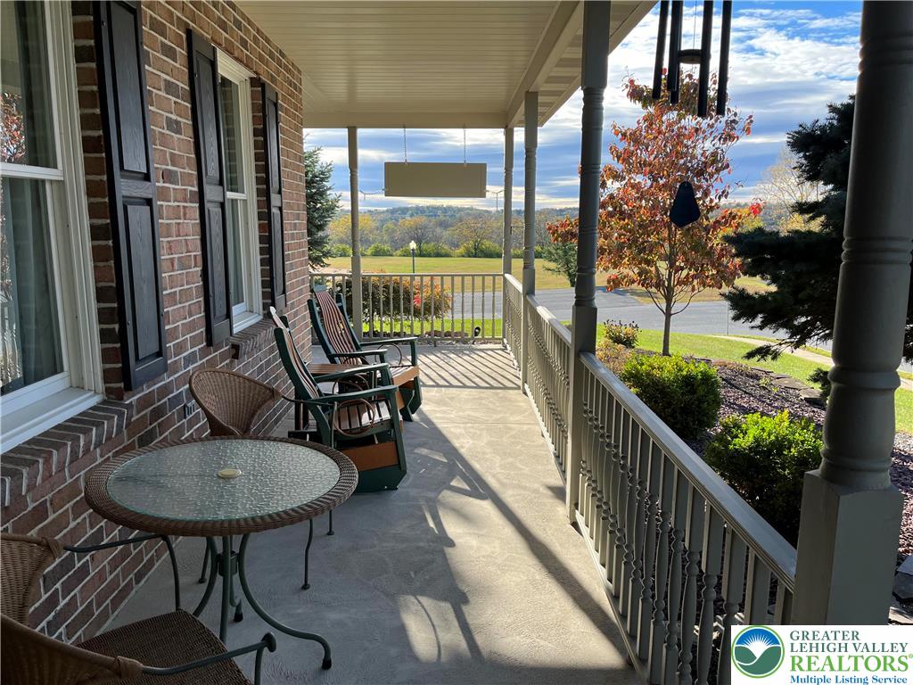205 Spyglass Hill Road Bath, PA 18014 - Photo 37 of 51 a view of balcony and chairs with wooden floor