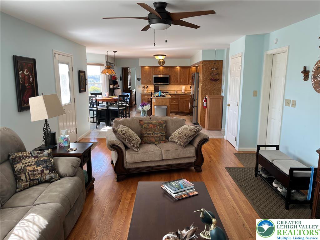 205 Spyglass Hill Road Bath, PA 18014 - Photo 7 of 51 a living room with furniture and a wooden floor
