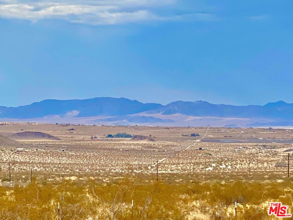 a view of an ocean and a mountain