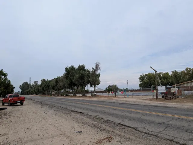 a view of a backyard with sitting area