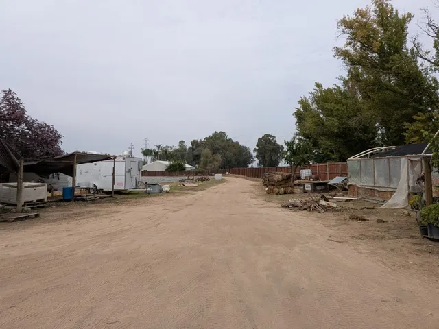 a view of street with parked cars