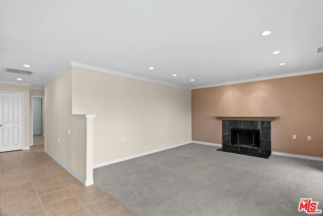 an empty room with a fireplace