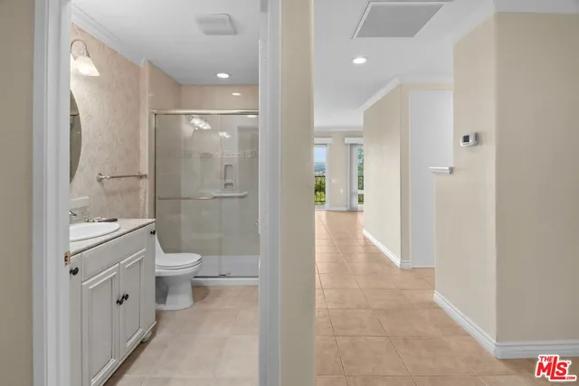 a view of a hallway with closet and utility room