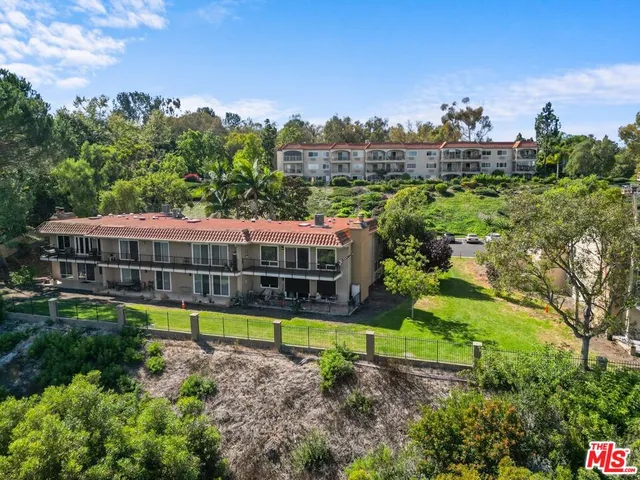 an aerial view of a house with a garden