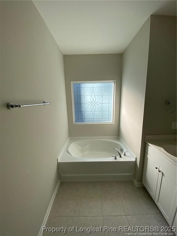 1206 Wingstem Place Raleigh, NC 27607 - Photo 15 of 17 a spacious bathroom with a bathtub and window