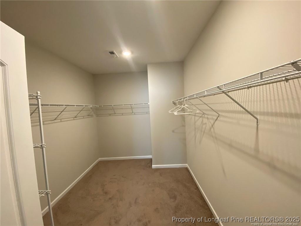 1206 Wingstem Place Raleigh, NC 27607 - Photo 16 of 17 a view of a room with racks on the wall