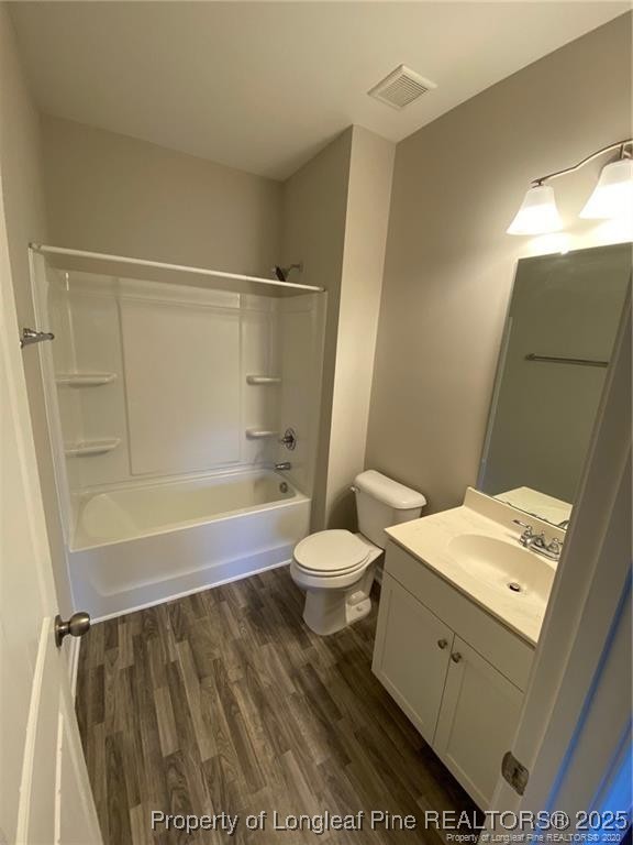 1206 Wingstem Place Raleigh, NC 27607 - Photo 5 of 17 a bathroom with a sink a toilet and shower